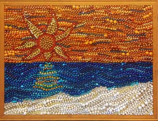 "Starburst Sunset", mardi gras bead mosaic by Ruth Warren